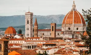 Florence skyline with Duomo, Giotto's Campanile, and terracotta rooftops.