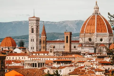 Florence skyline with Duomo, Giotto's Campanile, and terracotta rooftops.
