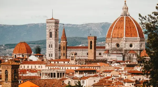 Florence skyline with Duomo, Giotto's Campanile, and terracotta rooftops.